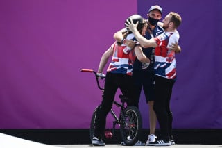 Jamie Bestwick celebrates with Charlotte Worthington and Declan Brooks at the Tokyo 2020 Olympic Games