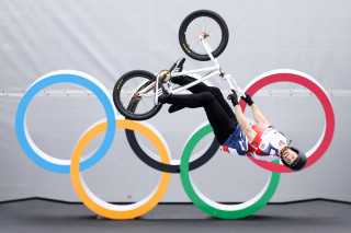 Declan Brooks in front of the Olympic rings at the Tokyo 2020 Olympic Games