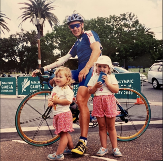 A child Sophie Capewell stands with her sister and dad