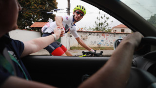 Team GB's Adam Yates collects feed supplies during a training ride in Rio